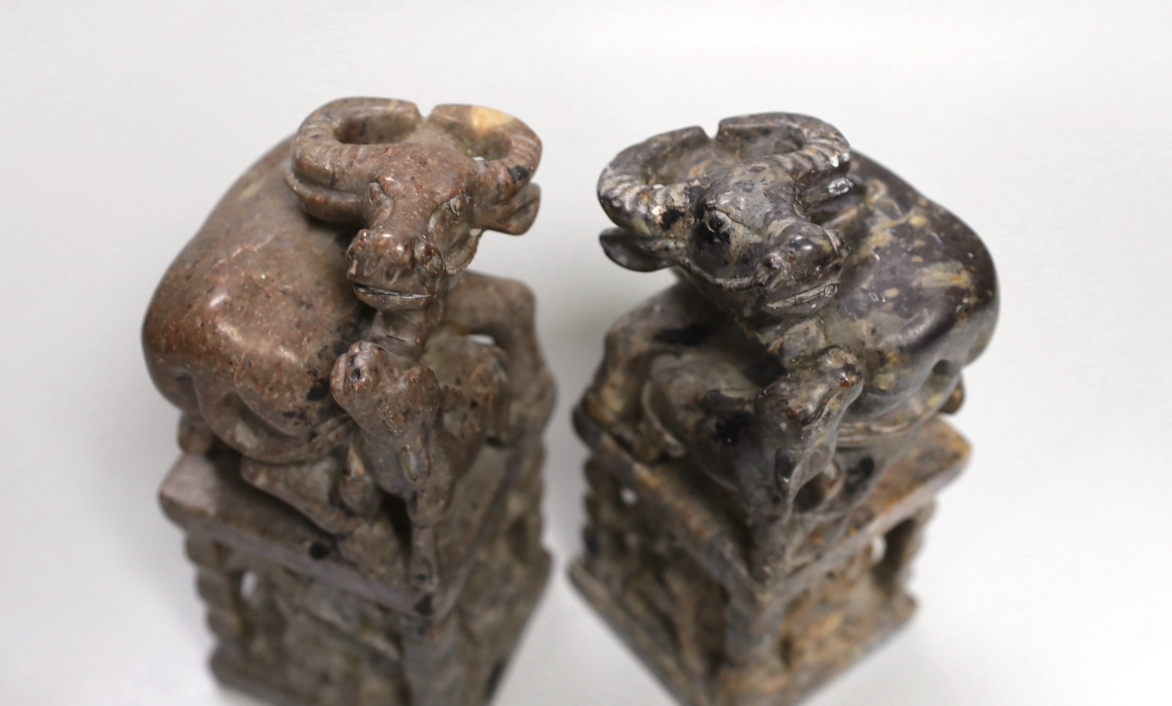 A pair of large Chinese soapstone 'buffalo' seals, 21cm